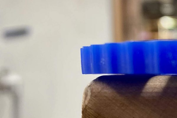 Laser cutters need to be strictly perpendicular to the cutting surface and the focal point in the center of the material to minimize the cut draft angle.